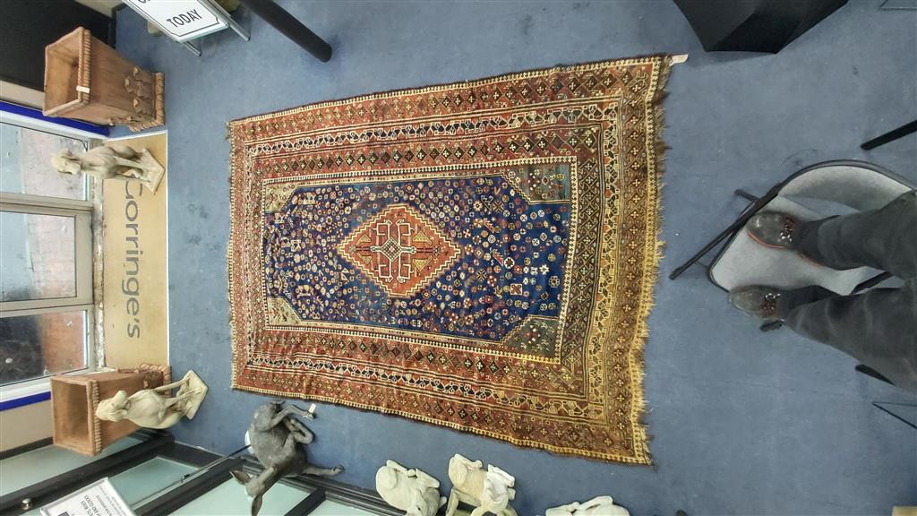 A Shiraz blue ground carpet, 305 x 214cm